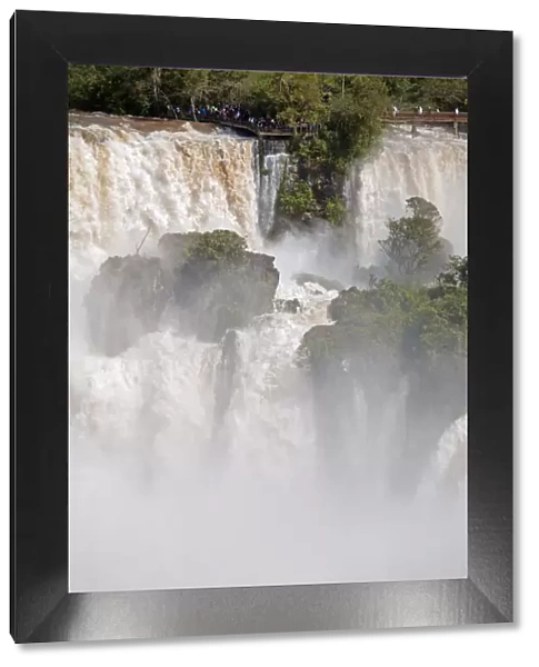South America, Brazil, Parana, a viewing platform at the Iguazu falls in full flood