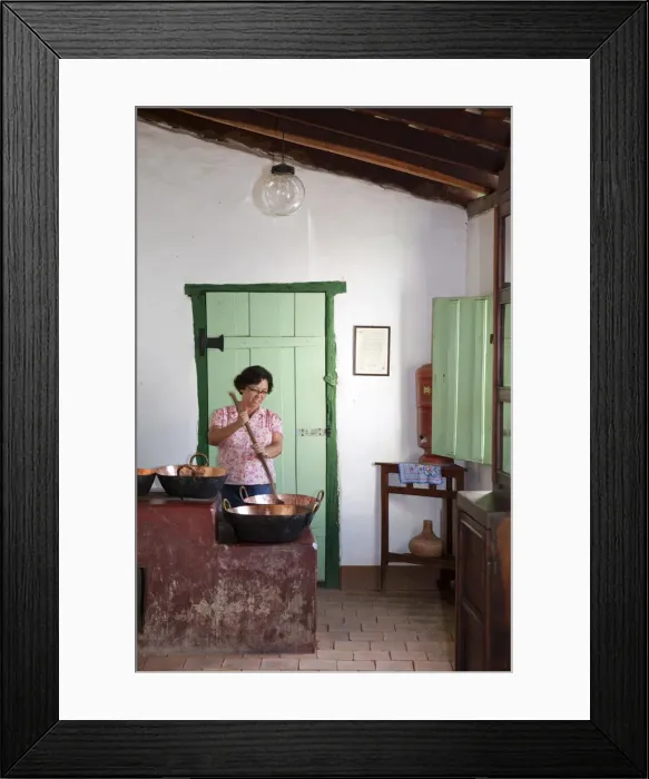 Framed Print : South America, Brazil, Goias, Cidade de Goias, A woman stirring a traditional copper