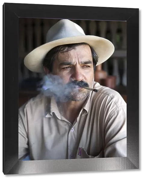 South America, Brazil, Goias, Pirenopolis, a man smoking a Corn Husk Cigarette in