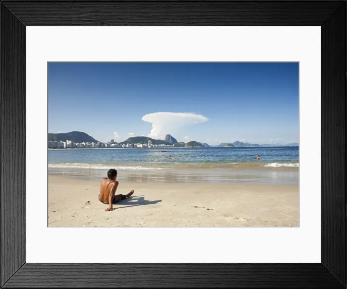 Framed Print : South America, Rio de Janeiro, Rio de Janeiro city, a sunbather at the end of Copacabana Framed Print : South America, Rio de Janeiro, Rio de Janeiro city, a sunbather at the end of Copacabana