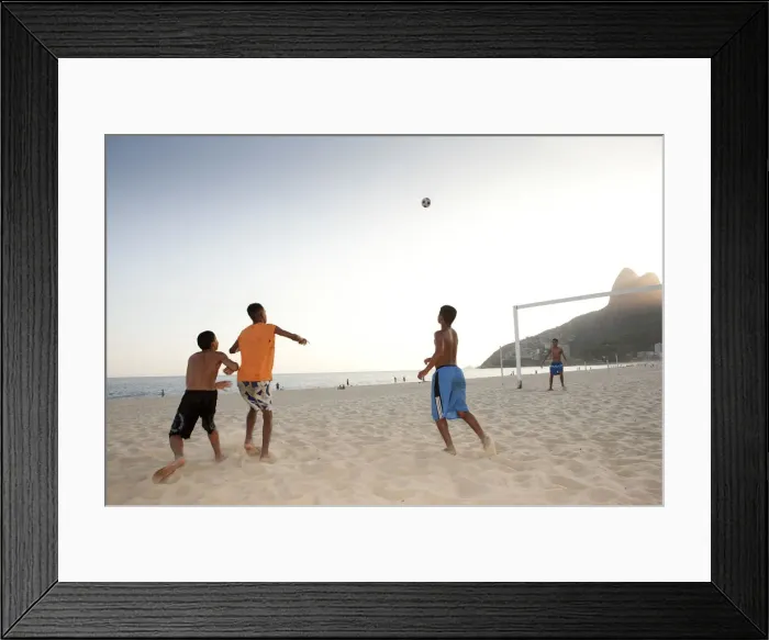 Framed Print : South America, Rio de Janeiro, Rio de Janeiro city, Ipanema, boys playing football Framed Print : South America, Rio de Janeiro, Rio de Janeiro city, Ipanema, boys playing football