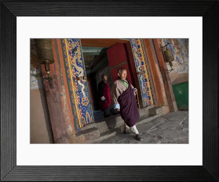 Framed Print : Bhutan. A monk walking through a doorway at the Gangtey Gompa