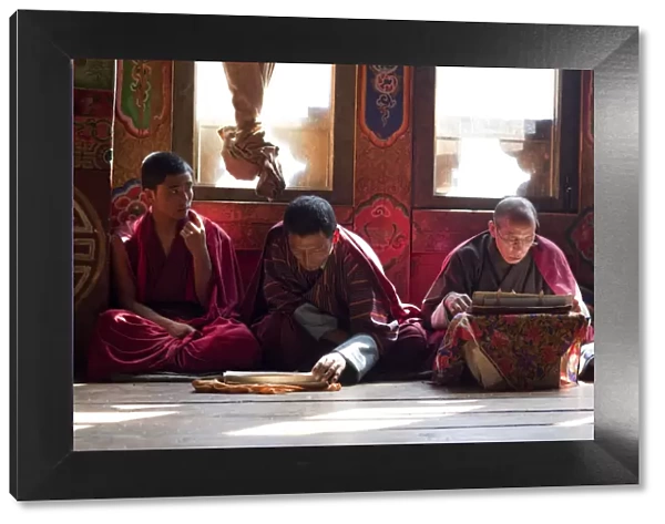 Monks at the sacred thread ceremony for the deceased in the monestery un Ura, Bumthang