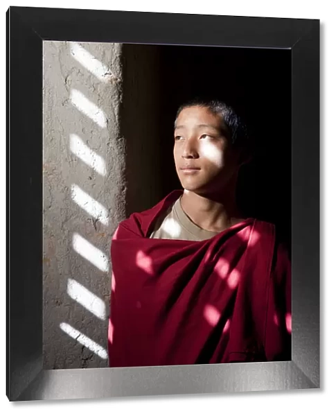 A young monk at the blue palace in Bhutan