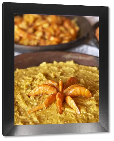 Brazil, Food, a bowl of vatapa with king prawns, a typical dish from Bahia made with