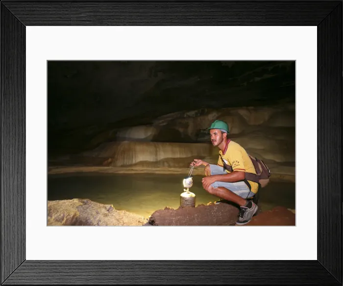 Framed Print : Brazil, Bahia, Chapada Diamantina, a guide in the Gruta da Lapa Doce caves in Framed Print : Brazil, Bahia, Chapada Diamantina, a guide in the Gruta da Lapa Doce caves in