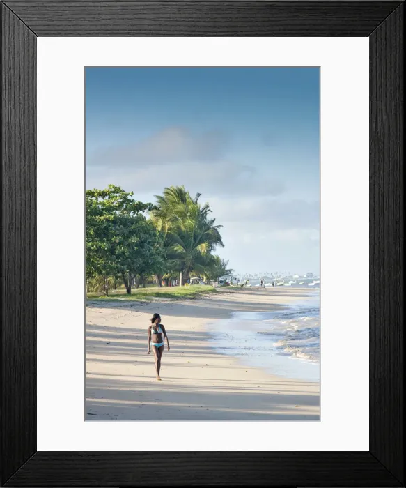 Framed Print : South America, Brazil, Bahia, a black Brazilian model in a bikini woman walks along Framed Print : South America, Brazil, Bahia, a black Brazilian model in a bikini woman walks along