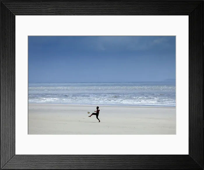 Framed Print : South America, Brazil, Maranhao, Sao Luis, Sao Marcos beach, boy playing football