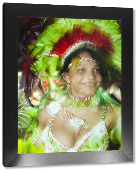 South America, Brazil, Maranhao, Sao Luis, a costumed dancer in a headdress at the