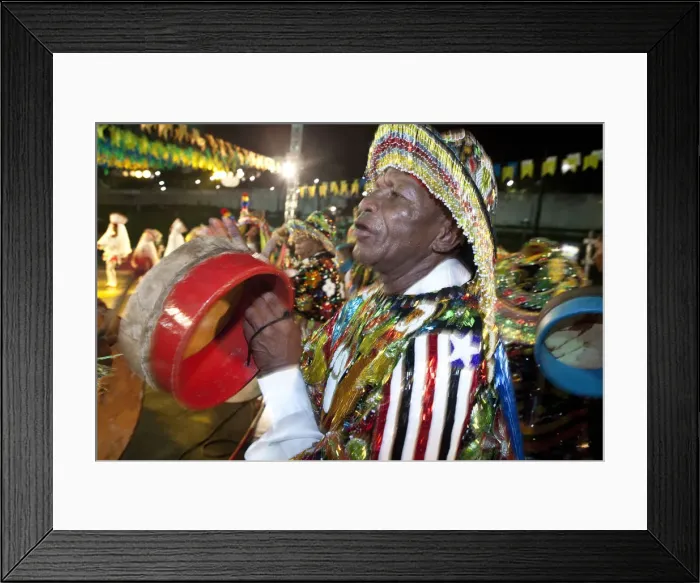 Framed Print : South America, Brazil, Maranhao, Sao Luis, a costumed dancer with tamborim drum instrument