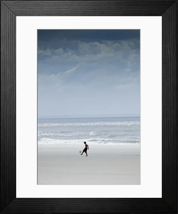 Framed Print : South America, Brazil, Maranhao, Sao Luis, Sao Marcos beach, boy playing football Framed Print : South America, Brazil, Maranhao, Sao Luis, Sao Marcos beach, boy playing football