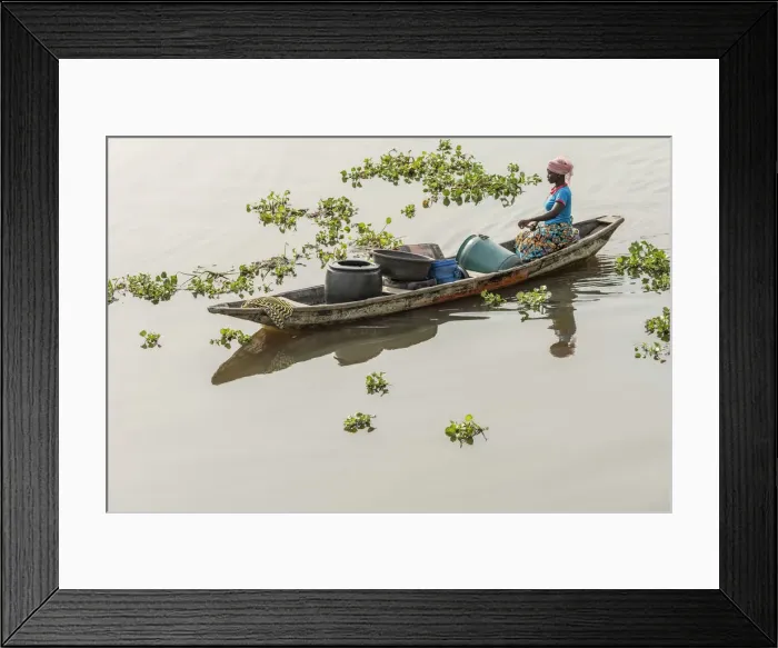 Framed Print : Africa, Benin, Lake Nokoua. A woman on the way to the waterseller in the famous stilt Framed Print : Africa, Benin, Lake Nokoua. A woman on the way to the waterseller in the famous stilt