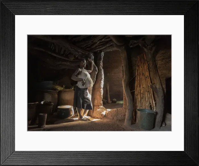 Framed Print : Africa, Benin, Boukumba. Pregnant woman standing inside a Tata Somba Framed Print : Africa, Benin, Boukumba. Pregnant woman standing inside a Tata Somba