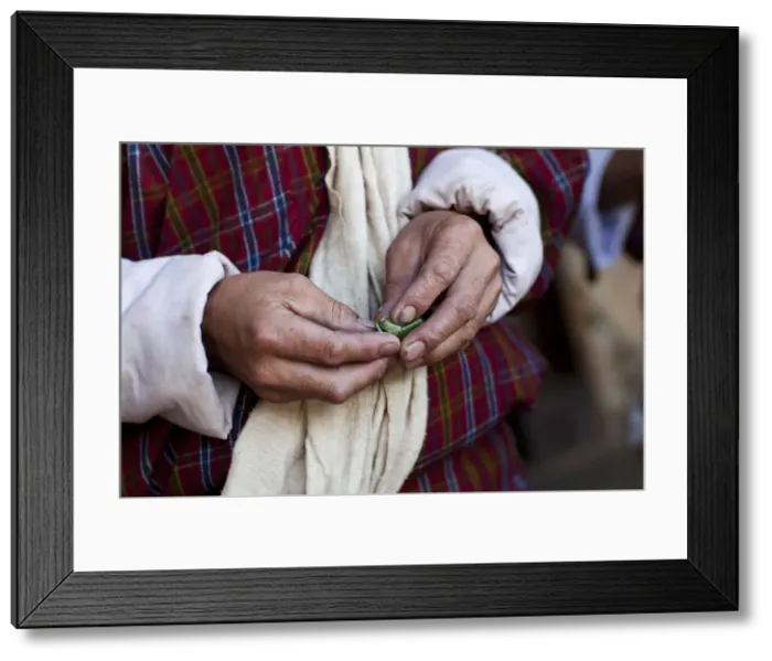 Framed Print : A Bhutanese man in a Gho eating Betel nut in Bhutan Framed Print : A Bhutanese man in a Gho eating Betel nut in Bhutan