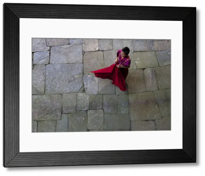 Framed Print : Jakar, Bhutan. A young monk at the Jakar Dzong in Bhutan