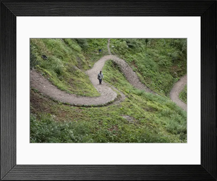 Framed Print : A tourist climbing the path to the Tango monastery near Thimpu, Bhutan Framed Print : A tourist climbing the path to the Tango monastery near Thimpu, Bhutan