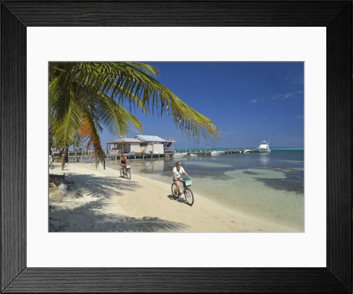 Framed Print : Tourists enjoying a bike ride along the beach at San Pedro, Ambergris Caye, Caribbean