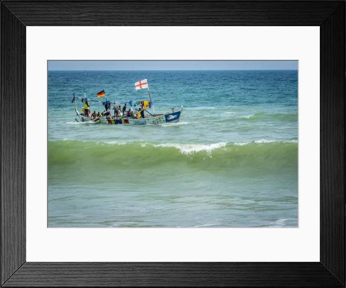 Framed Print : Africa, Benin, Grand Popo. A colorful fishing boat coming back home