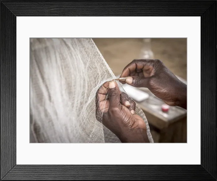 Framed Print : Africa, Benin, Grand Popo. Man repairing his fishing net. Detail Framed Print : Africa, Benin, Grand Popo. Man repairing his fishing net. Detail