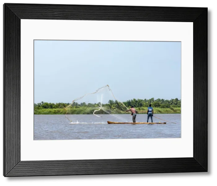 Framed Print : Africa, Benin, Mono Department. Fishermen in a traditional canoe casting a net Framed Print : Africa, Benin, Mono Department. Fishermen in a traditional canoe casting a net