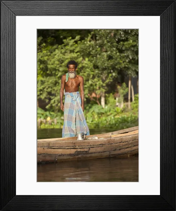 Framed Print : Jessore, Bangladesh. A traditional boatman transports milk to market Framed Print : Jessore, Bangladesh. A traditional boatman transports milk to market
