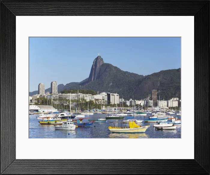 Framed Print : Moored boats in harbour with Christ the Redeemer statue in background, Urca, Rio de Framed Print : Moored boats in harbour with Christ the Redeemer statue in background, Urca, Rio de