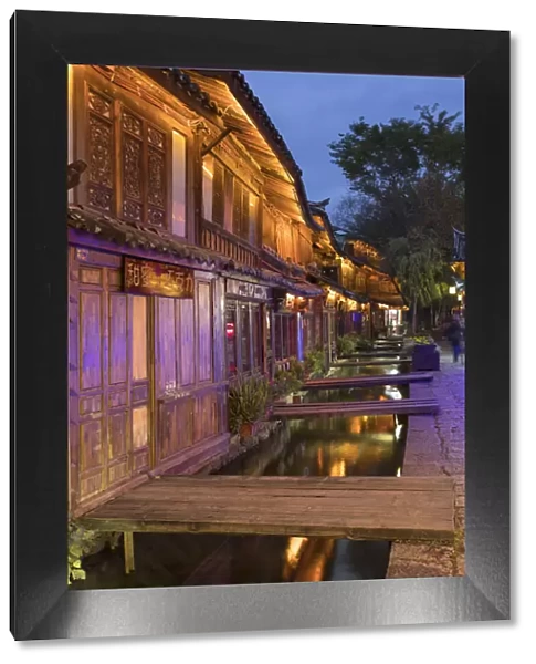 Bars and restaurants along canal at dusk, Lijiang (UNESCO World Heritage Site), Yunnan