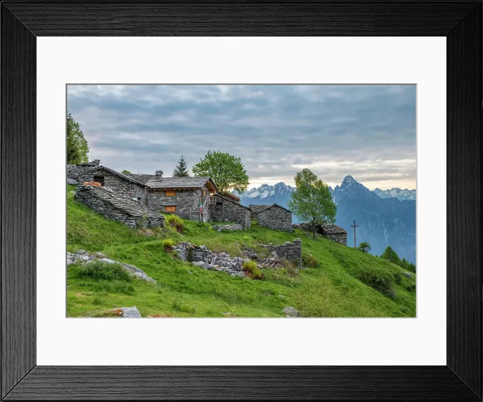 Framed Print : Traditional stone huts with high peak Pizzo di Prata in background, Alpe Buglio