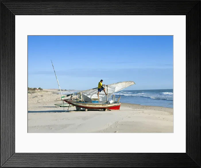 Framed Print : South America, Brazil, Ceara, Fortaleza, a fisherman tending his jangada on the beach