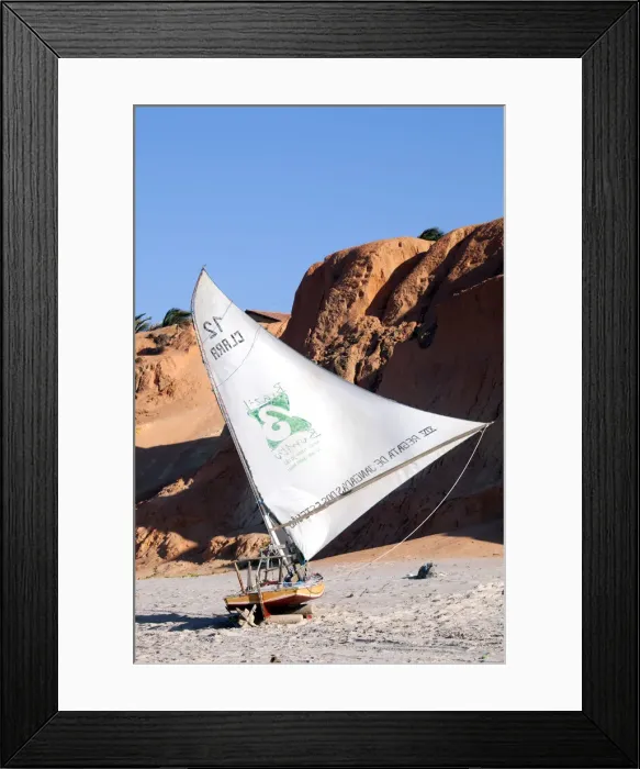 Framed Print : South America, Brazil, Ceara, Fortaleza, a jangada on the beach in front of deep red