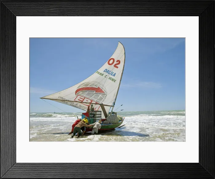 Framed Print : South America, Brazil, Ceara, Fortaleza, fishermen launching a jangada on the beach