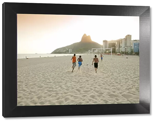 South America, Rio de Janeiro, Rio de Janeiro city, Ipanema, boys playing football