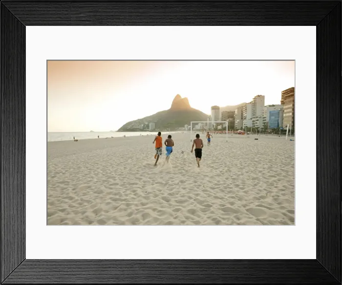 Framed Print : South America, Rio de Janeiro, Rio de Janeiro city, Ipanema, boys playing football Framed Print : South America, Rio de Janeiro, Rio de Janeiro city, Ipanema, boys playing football