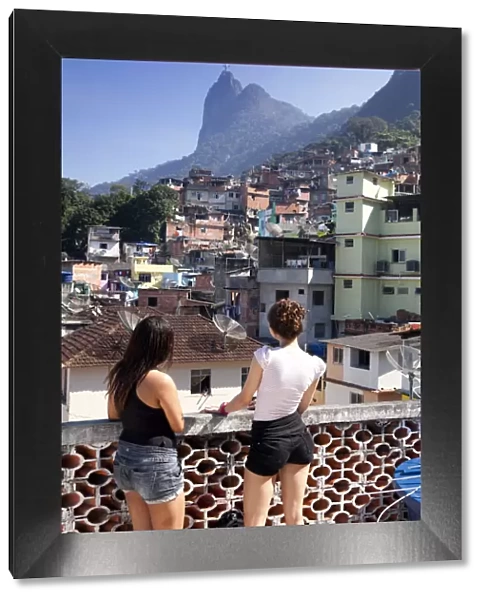 South America, Rio de Janeiro, Rio de Janeiro city, two girls look out over a view