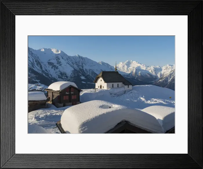 Framed Print : The white church of Bettmeralp in winter. Bettmeralep, Vallese, Switzerland, Europe