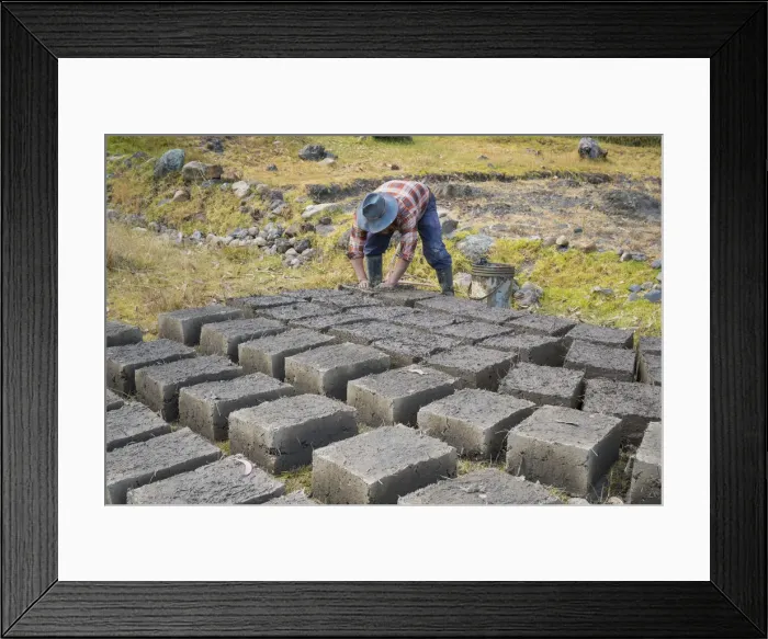 Framed Print : Man at work during manufacture of adobes, the clay brick Framed Print : Man at work during manufacture of adobes, the clay brick