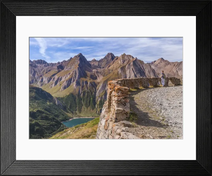 Framed Print : A girl admiring the mountains from the road to the Maria Luisa refuge and the high Framed Print : A girl admiring the mountains from the road to the Maria Luisa refuge and the high