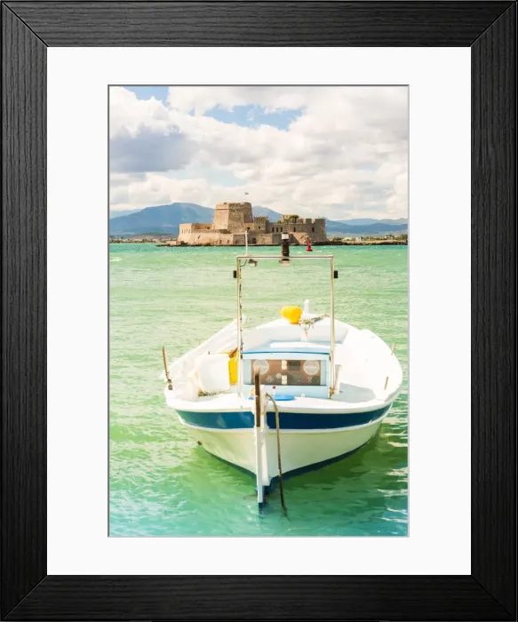 Framed Print : Close up of a boat docked in the Nafplio harbour and Bourtzi fortress in the background Framed Print : Close up of a boat docked in the Nafplio harbour and Bourtzi fortress in the background