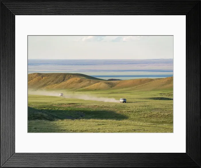 Framed Print : Two soviet vehicles driving on dirt roads. Bayandalai district, South Gobi province Framed Print : Two soviet vehicles driving on dirt roads. Bayandalai district, South Gobi province