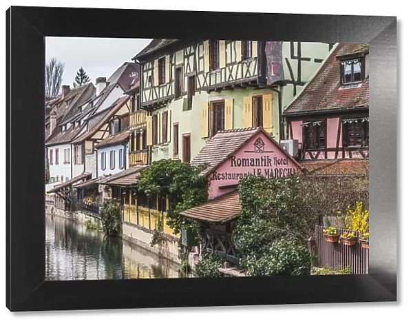 Canal waterfront view of traditional townhouses, Colmar, Grand Est, France