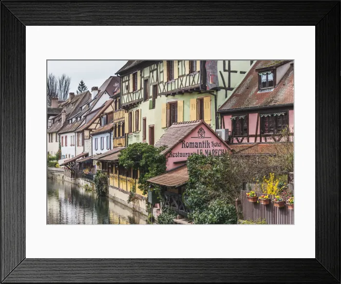 Framed Print : Canal waterfront view of traditional townhouses, Colmar, Grand Est, France Framed Print : Canal waterfront view of traditional townhouses, Colmar, Grand Est, France