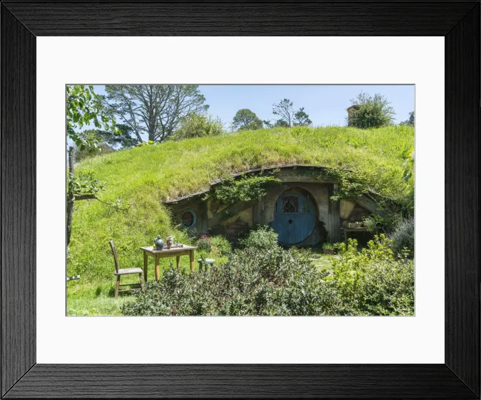 Framed Print : Hobbit house with table and chair in the garden Framed Print : Hobbit house with table and chair in the garden