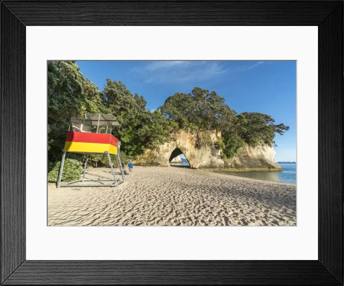 Framed Print : Lifeguard tower and Cave tunnel rock at Cathedral Cove