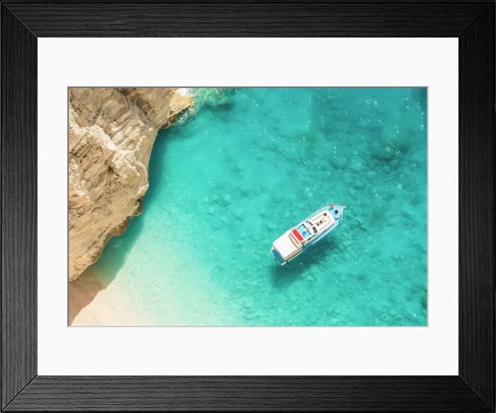 Framed Print : A man relaxing on his yacht docked at Navagio beach, Zakynthos, Ionian Islands, Greece Framed Print : A man relaxing on his yacht docked at Navagio beach, Zakynthos, Ionian Islands, Greece