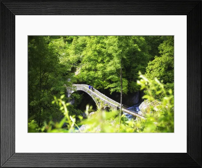Framed Print : Two persons walks on the Ponte della Merla(Merla Bridge). Maggia River, Brontallo Framed Print : Two persons walks on the Ponte della Merla(Merla Bridge). Maggia River, Brontallo
