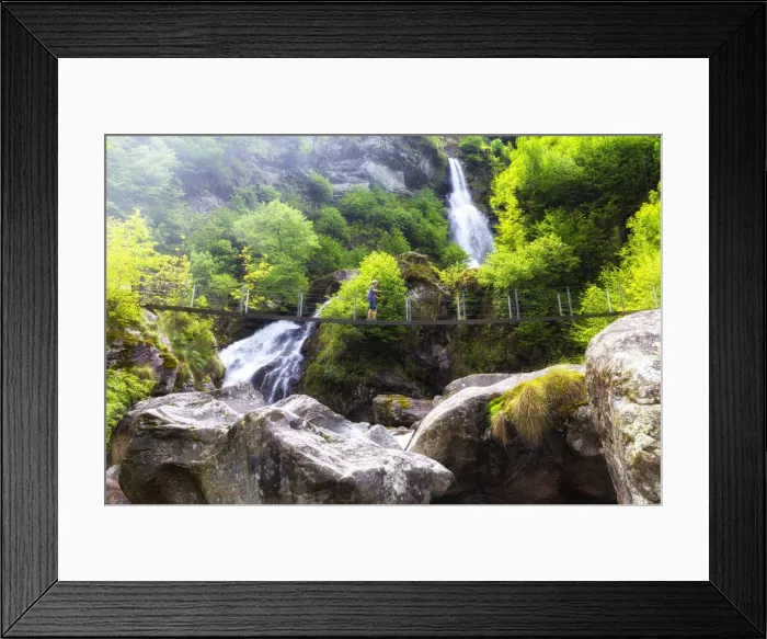 Framed Print : A tourit walks on a Tibetan bridge near the Cascata del Ri da Sernel, Brontallo, Val
