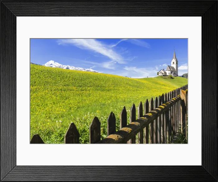 Framed Print : Summer flowering at the traditional church of Davos Wiesen, Parc Ela, Prettigau  /  Davos