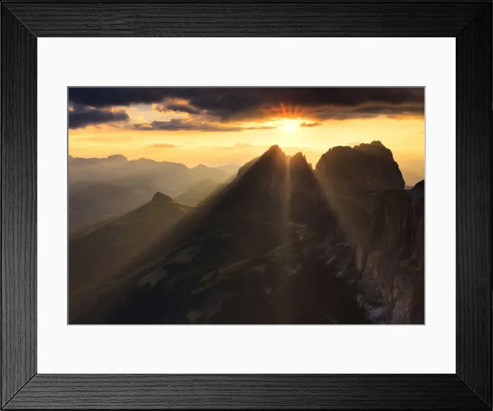 Framed Print : Sun rays filters between stormy clouds during sunset with Sassolungo group in Framed Print : Sun rays filters between stormy clouds during sunset with Sassolungo group in