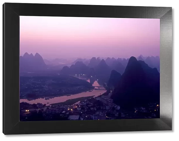 China, Guangxi Province, Yangshuo. The view from above Yangshuo just before sunrise