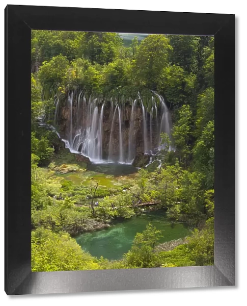 Plitvice National Park, Croatia. A waterfall and a lake into the national park in